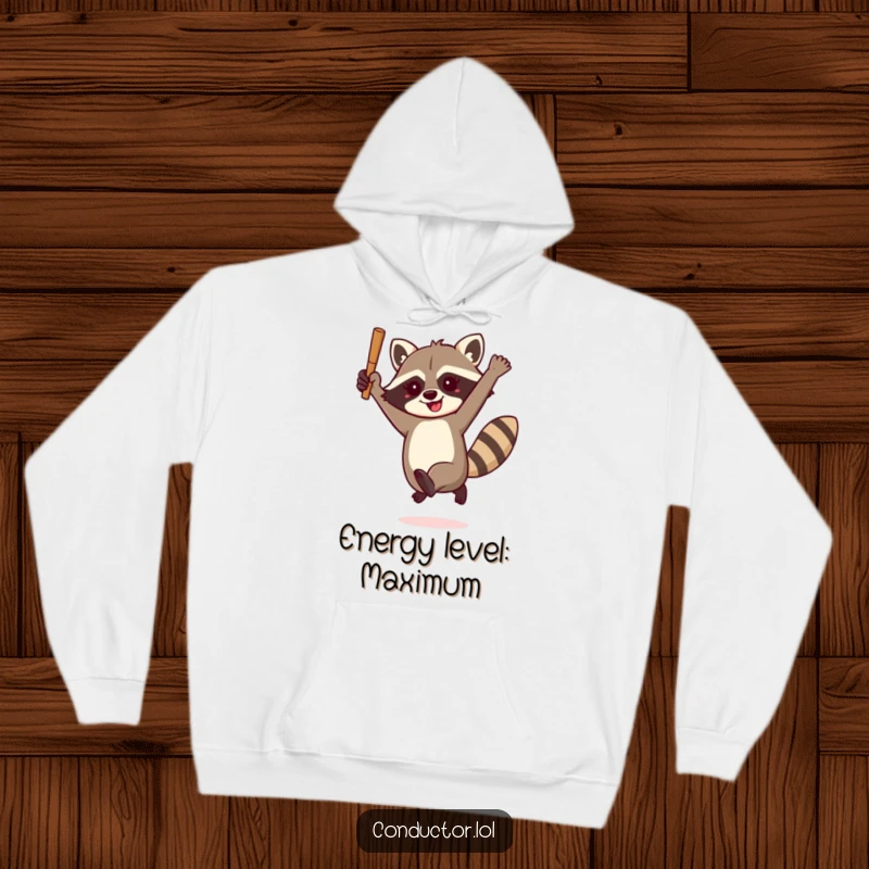 Funny raccoon conductor hoodie, enthusiastically leaping with a baton, offering cozy comfort and a dose of wild, humorous musicality.