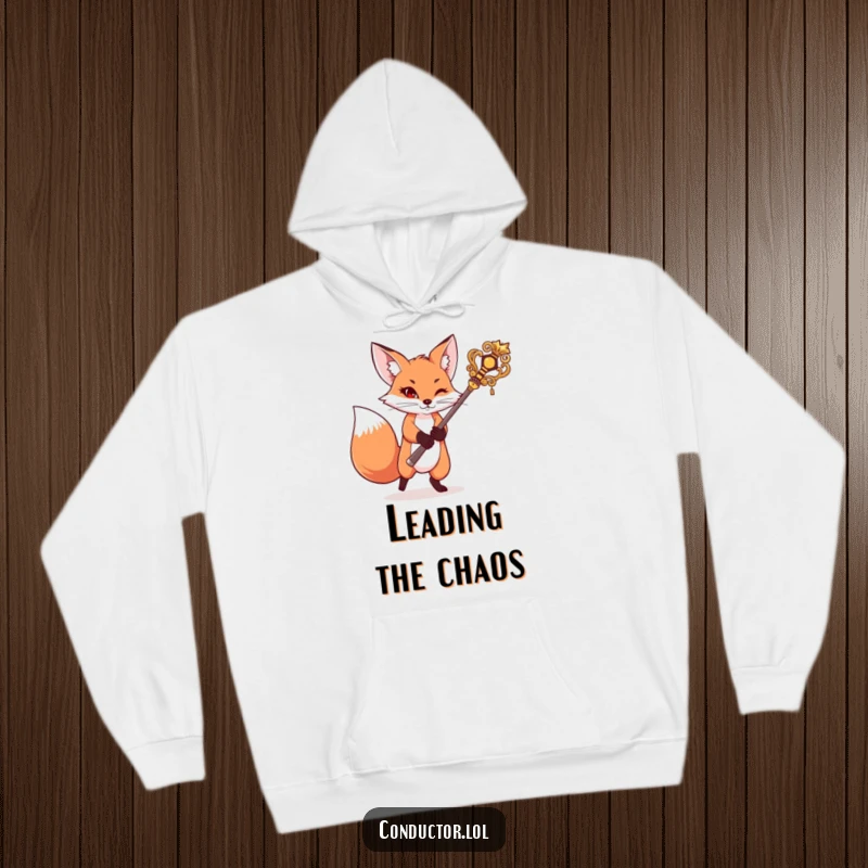 Funny hoodie with a mischievous fox swinging an ornate baton, exuding playful command and cozy warmth, a humorous statement piece.